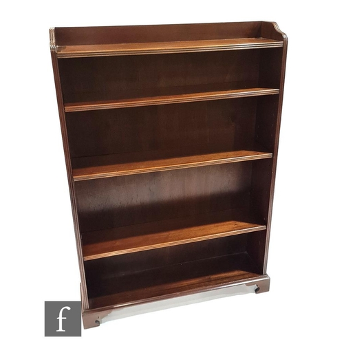 1208 - An Edwardian mahogany floorstanding open bookcase, shaped reeded edge top over four adjustable shelv... 