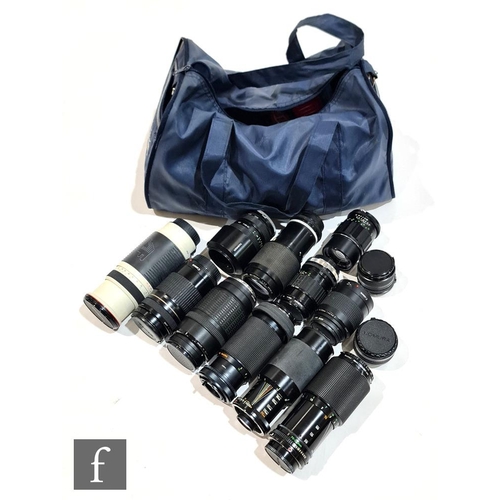 689 - A collection of camera lenses and accessories, to include a Cosina 400mm f.4.5-6.7 super telephoto l... 