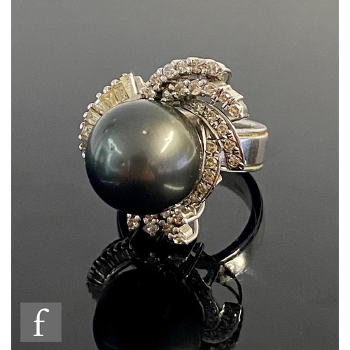 545 - A 14ct hallmarked white gold south sea cultured pearl and diamond cluster ring, central pearl within... 