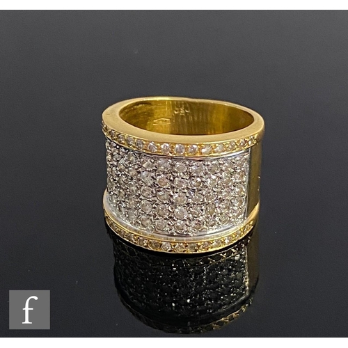 546 - An 18ct diamond ring comprising seven rows of pave set brilliant cut diamonds to a plain wide shank,... 