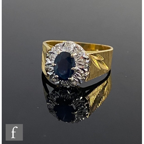 550 - An 18ct sapphire and diamond cluster ring, central sapphire within a border of diamonds to wide bark... 