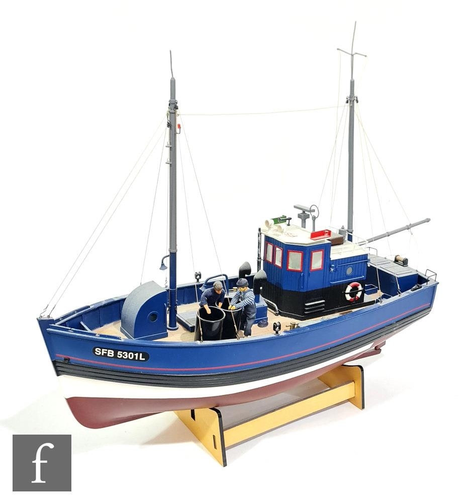 A Lobmaster model lobster fishing boat, complete with crew figures, display  stand and box, together