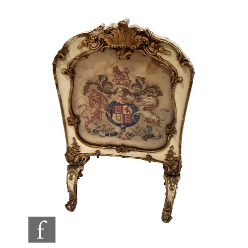 1218 - A 19th Century painted and gilded pine fire screen of arched panel form, with acanthus scroll pedime... 