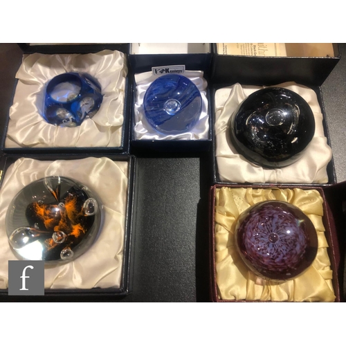 315 - A collection of later 20th Century boxed decorative paperweights to include three Caithness examples... 