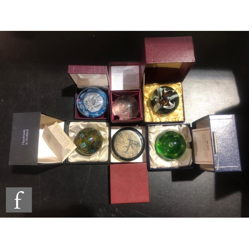 315 - A collection of later 20th Century boxed decorative paperweights to include three Caithness examples... 