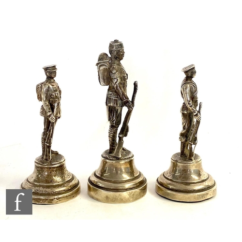 343 - Three hallmarked silver studies of standing soldiers, tallest 10cm, with two further modern white me... 