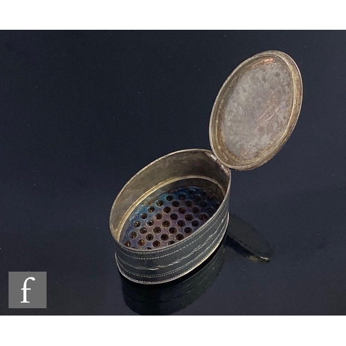 411 - A George III hallmarked silver oval nutmeg grater with bright cut leaf border, iron rasp, length 3.5... 