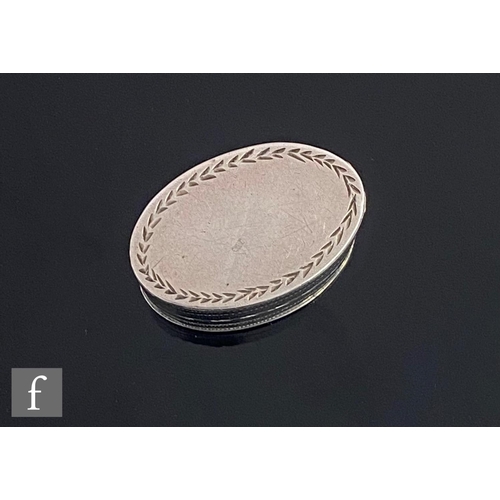 411 - A George III hallmarked silver oval nutmeg grater with bright cut leaf border, iron rasp, length 3.5... 