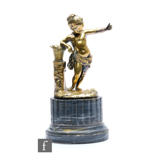 466 - A 19th Century gilt metal figure of a putti wearing a bag and a sash with outstretched hand near a b... 