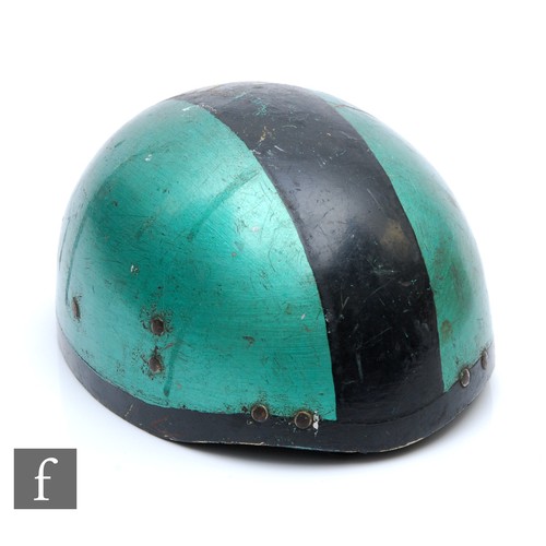 9164 - A 1950s cork motorcycle helmet, later painted green and black with original lining and leather strap... 