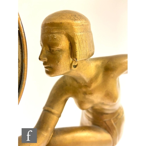 543 - Unknown - A 1930s Art Deco gilt metal model of a scantily clad female dancer with bobbed hair and st... 