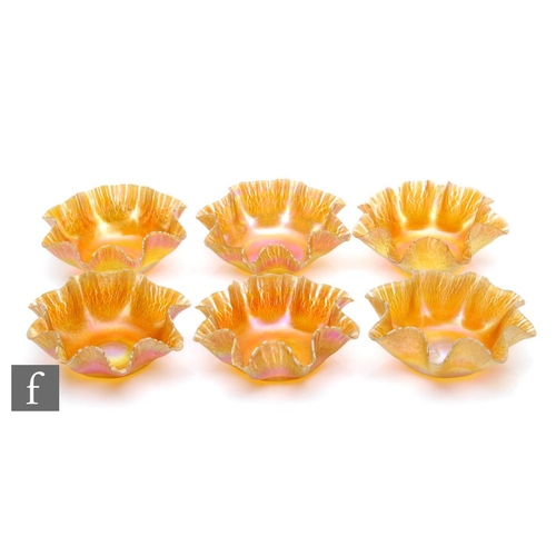 28 - Louis Comfort Tiffany - A set of six glass finger bowls, of circular section with frilled rim all in... 