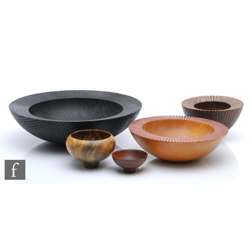 1368 - Mike Wilson - A group of contemporary wooden bowls to include a large blackened cedar, a medium wild... 