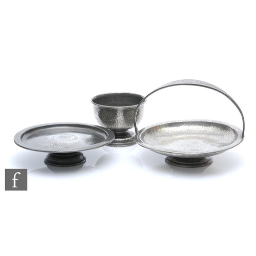 45 - Liberty & Co. - A collection of Tudric pewter items, to include a pedestal tazza with fixed hand... 