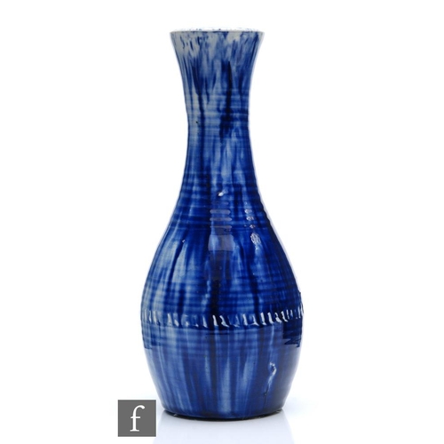 209 - William Moorcroft - A Natural Pottery skittle vase glazed in blue with visible throwing lines, Moorc... 