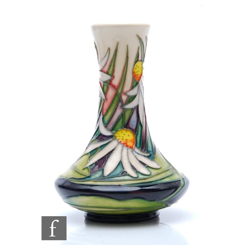 263 - Emma Bossons - Moorcroft Pottery - A boxed vase of compressed globe and shaft form decorated in the ... 