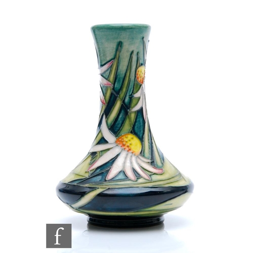 264 - Emma Bossons - Moorcroft Pottery - A boxed vase of compressed globe and shaft form in the Michaelmas... 