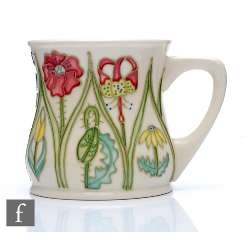 269 - Moorcroft Pottery - Two boxed mugs, the first designed by Sian Leeper to celebrate twenty years of t... 