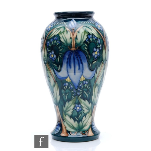 272 - Alicia Amison - Moorcroft Pottery - A boxed vase of tapering form decorated in the Alpina pattern, i... 