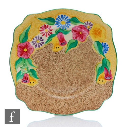 414 - Clarice Cliff - Petunia - A large Leda shape plate circa 1933, hand painted with a band of stylised ... 