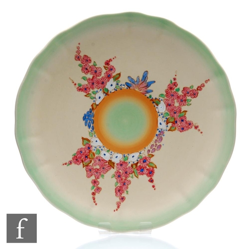 417 - Clarice Cliff - Hollyhocks (Variant) - A large wave edge wall plaque circa 1938, radially hand paint... 