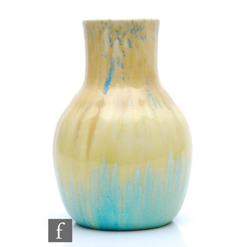 77 - Ruskin Pottery - A crystalline glaze vase decorated in a yellow over a blue green with blue crystall... 