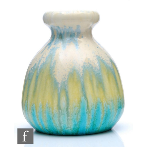 87 - Ruskin Pottery - A crystalline glaze vase of globular form with a knop neck decorated in ivory to ye... 