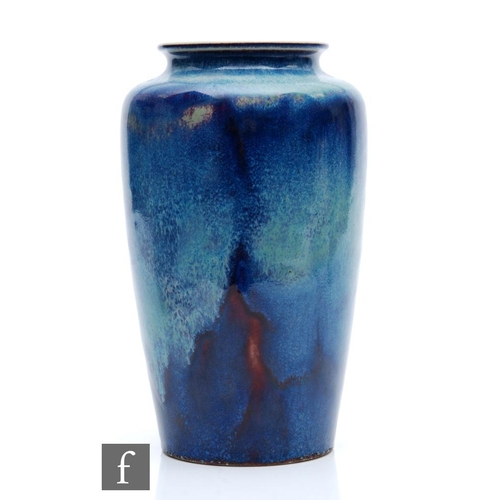 88 - Ruskin Pottery - A high fired vase of shouldered form decorated with a sweeping lavender and ice blu... 