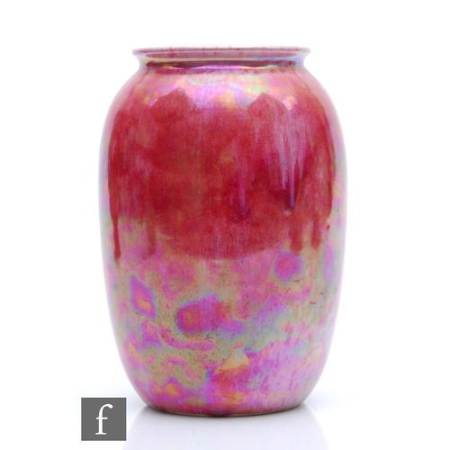 90 - Ruskin Pottery - A vase of swollen form decorated in a Strawberry Crush mottled pink, impressed mark... 