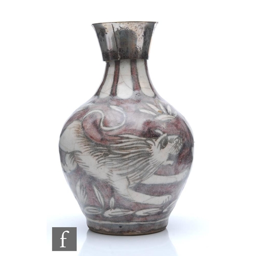 52 - Unknown - A late 19th Century vase decorated in the Persian style with a stylised lion chasing a har... 