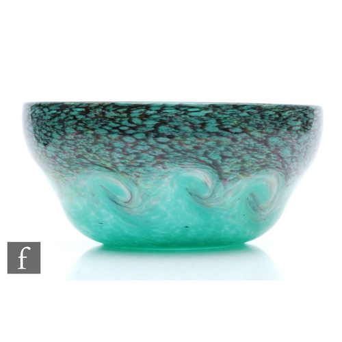 710 - Strathearn - A post war bowl decorated with mottled and adventurine swirls against a tonal green gro... 