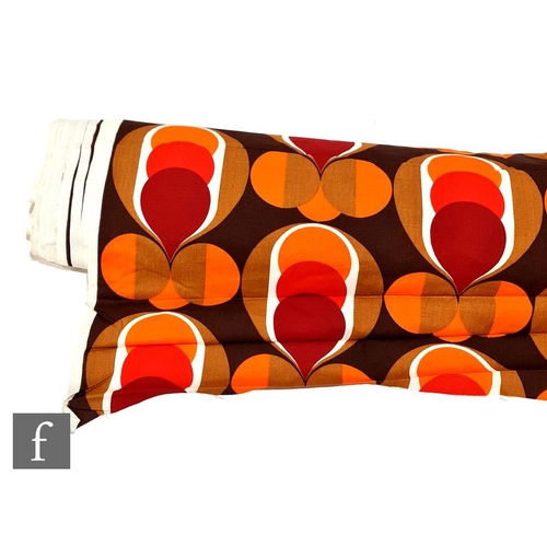 1004 - Unknown - A large roll of 1970s fabric printed with a repeat geometric pattern in shades of red, ora... 