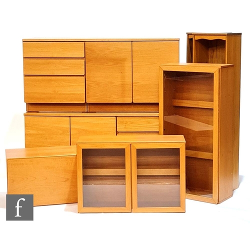 1367 - Beaver & Tapley - A group of teak veneered modular furniture units to comprise two double door c... 