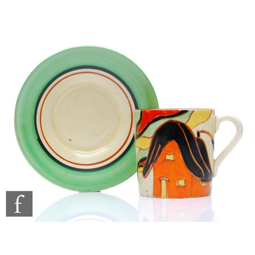 327 - Clarice Cliff - Orange House - A Tankard shape coffee cup and saucer circa 1930, hand painted with a... 