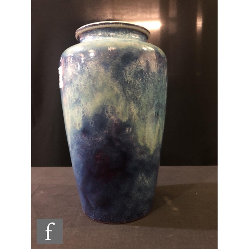 88 - Ruskin Pottery - A high fired vase of shouldered form decorated with a sweeping lavender and ice blu... 