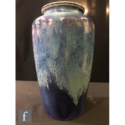 88 - Ruskin Pottery - A high fired vase of shouldered form decorated with a sweeping lavender and ice blu... 