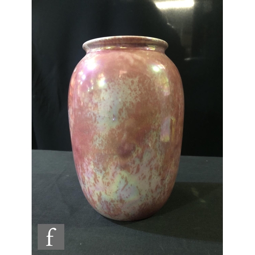 90 - Ruskin Pottery - A vase of swollen form decorated in a Strawberry Crush mottled pink, impressed mark... 