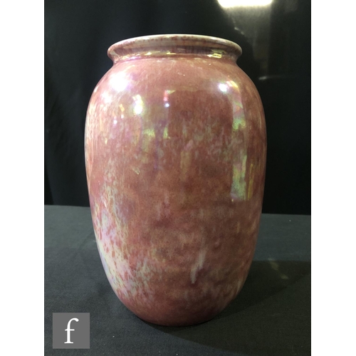 90 - Ruskin Pottery - A vase of swollen form decorated in a Strawberry Crush mottled pink, impressed mark... 