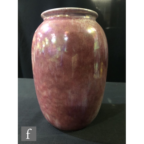 90 - Ruskin Pottery - A vase of swollen form decorated in a Strawberry Crush mottled pink, impressed mark... 