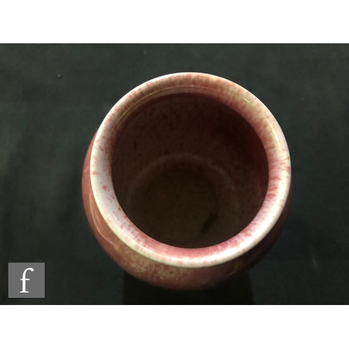 90 - Ruskin Pottery - A vase of swollen form decorated in a Strawberry Crush mottled pink, impressed mark... 