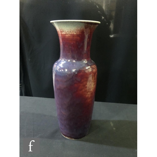 123 - Ruskin Pottery - A large high fired vase of high shouldered form with a flared neck decorated in a s... 