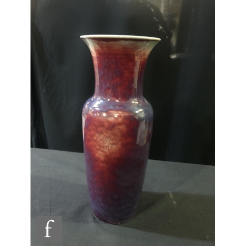 123 - Ruskin Pottery - A large high fired vase of high shouldered form with a flared neck decorated in a s... 