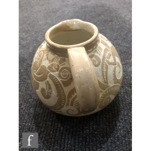 560 - Unknown - A French Art Deco ceramic jug circa 1920 to 1925, of squat ovoid form with applied loop ha... 