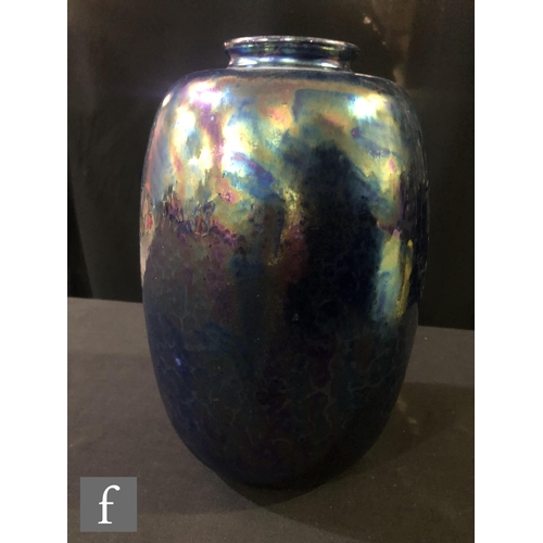 79 - Ruskin Pottery - A large vase of swollen form decorated in an all over Kingfisher Blue lustre, impre... 