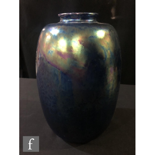 79 - Ruskin Pottery - A large vase of swollen form decorated in an all over Kingfisher Blue lustre, impre... 