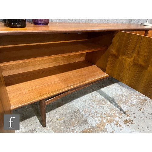 856 - G-Plan Furniture - A teak sideboard, model number 4058, fitted with an arrangement of four central d... 