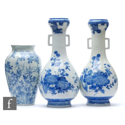 181 - A collection of Japanese blue and white porcelain items, to include a pair of arrow shaped vases, de... 