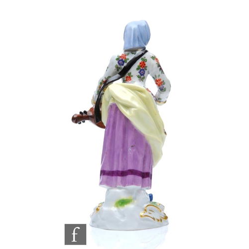 141 - A 19th Century Meissen Street Trader figure from the Cris de Paris series modelled as the Hurdy Gurd... 