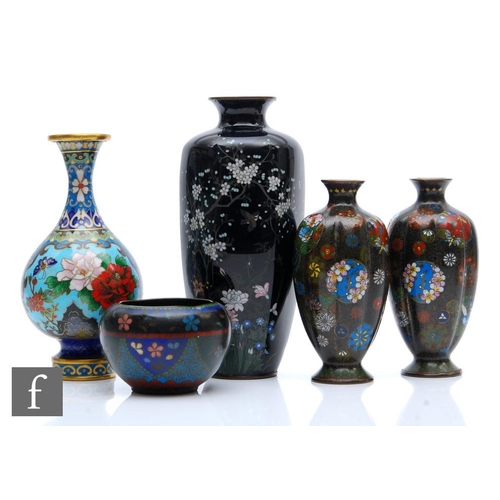 151 - A collection of Chinese and Japanese cloisonne vases, to include a bottle form vase, decorated with ... 