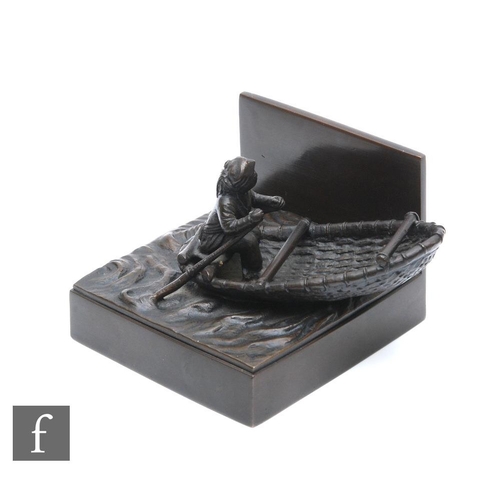 171 - A Japanese Meiji Period (1868-1912), bronze figure of a fisherman in a coracle, stamped character ma... 